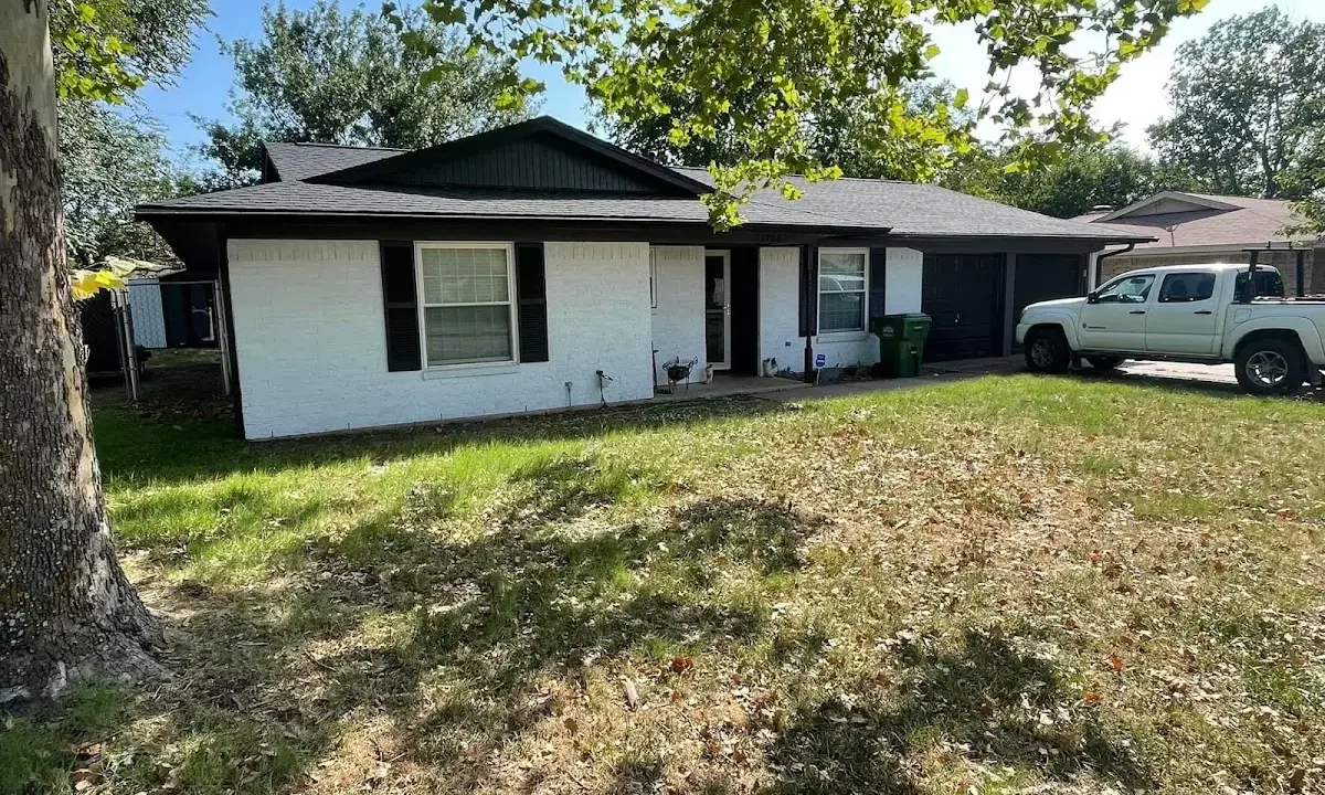 Professional roofing crew working on a residential roof in Poplar Grove